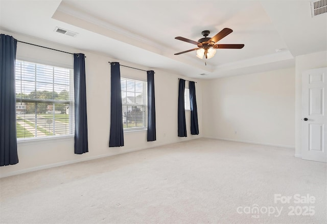 3043 Streamlet Way, Monroe, NC 28110 - spare room featuring a raised ceiling, healthy amount of natural light, carpet, a ceiling fan, and crown molding