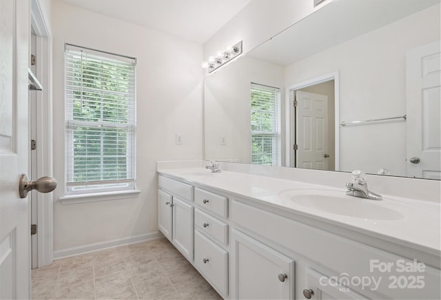 3043 Streamlet Way, Monroe, NC 28110 - bathroom with double vanity and baseboards