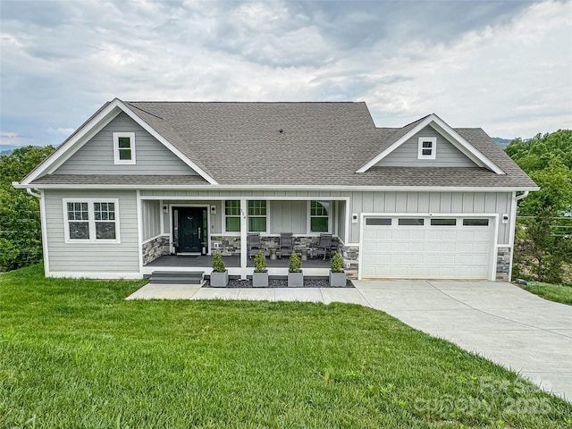 154 Amblers Knoll Rd, Weaverville, NC 28787 - view of front of house with board and batten siding, covered porch, an attached garage, a shingled roof, and driveway