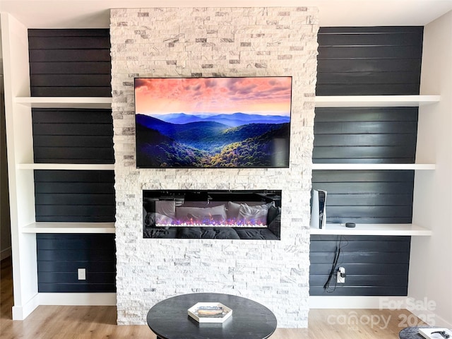 154 Amblers Knoll Rd, Weaverville, NC 28787 - detailed view of wood finished floors, a stone fireplace, and built in features