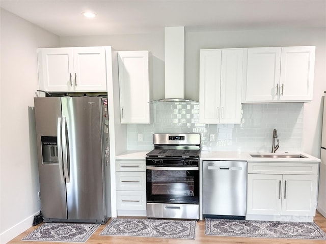 154 Amblers Knoll Rd, Weaverville, NC 28787 - kitchen with appliances with stainless steel finishes, wall chimney range hood, light countertops, and white cabinetry