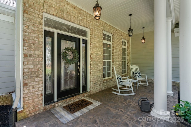 347 Bayberry Creek Cir, Mooresville, NC 28117 - view of exterior entry featuring covered porch and brick siding