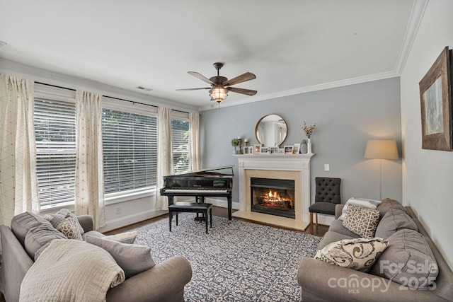 347 Bayberry Creek Cir, Mooresville, NC 28117 - living room featuring ceiling fan, a lit fireplace, crown molding, and wood finished floors