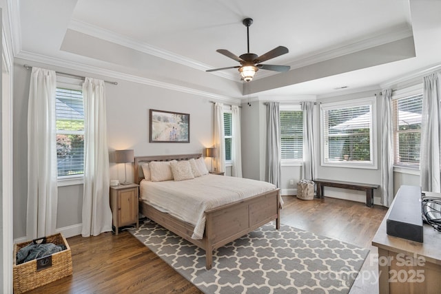 347 Bayberry Creek Cir, Mooresville, NC 28117 - bedroom featuring a raised ceiling, wood finished floors, crown molding, and ceiling fan