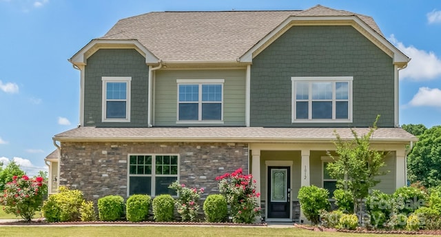 1012 Leland Dr, Wesley Chapel, NC 28104 - craftsman house featuring covered porch, a shingled roof, and a front lawn