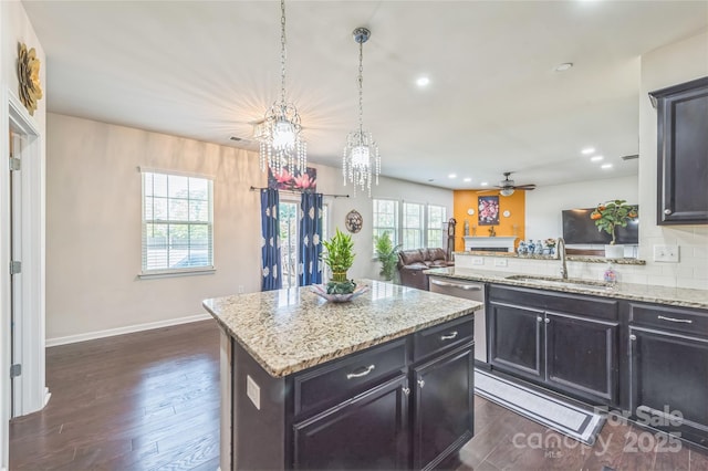 1012 Leland Dr, Wesley Chapel, NC 28104 - kitchen with open floor plan, dark wood-type flooring, ceiling fan, recessed lighting, and decorative backsplash