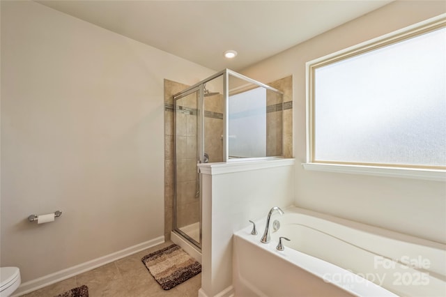 1012 Leland Dr, Wesley Chapel, NC 28104 - bathroom with a bath, a shower stall, and tile patterned floors