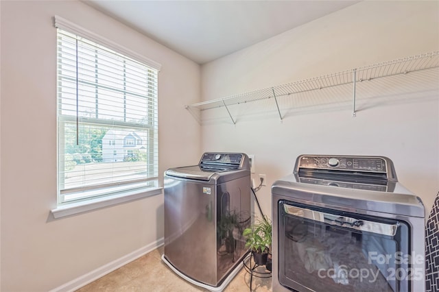1012 Leland Dr, Wesley Chapel, NC 28104 - washroom featuring washer and clothes dryer and baseboards