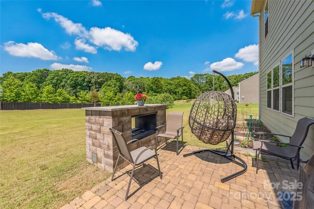 1012 Leland Dr, Wesley Chapel, NC 28104 - view of patio featuring an outdoor stone fireplace