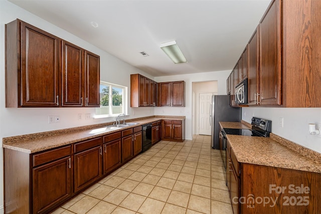 124 Glade Valley Ave, Mooresville, NC 28117 - kitchen with black appliances, light tile patterned floors, and light countertops