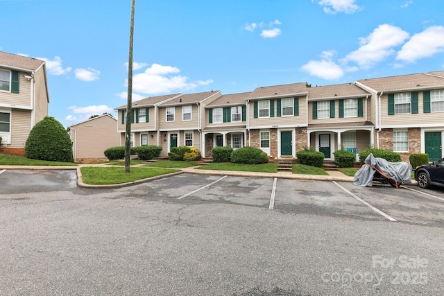 9606 Vinca Cir Unit E, Charlotte, NC 28213 - view of front of home with uncovered parking and a residential view