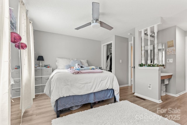 9606 Vinca Cir Unit E, Charlotte, NC 28213 - bedroom featuring wood finished floors and a ceiling fan