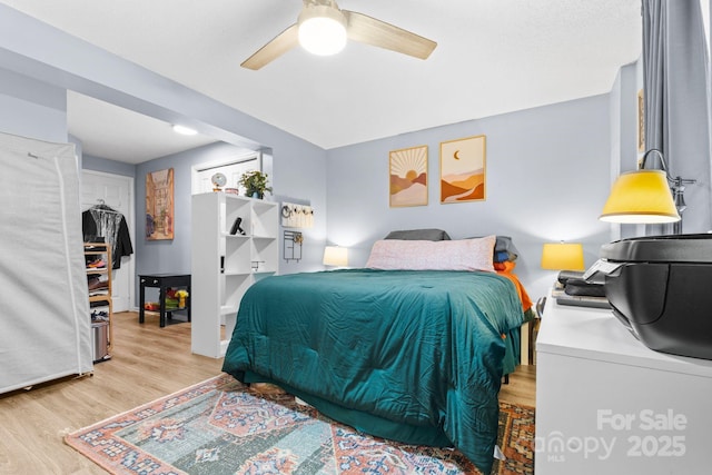 9606 Vinca Cir Unit E, Charlotte, NC 28213 - bedroom featuring light wood finished floors and a ceiling fan
