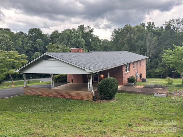 356 Lucky Hollow Rd, Hickory, NC 28601 - ranch-style home with a front lawn, brick siding, asphalt driveway, a chimney, and roof with shingles