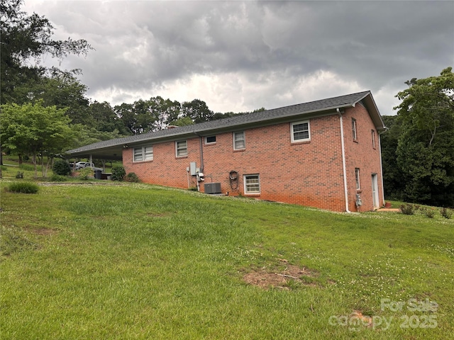 356 Lucky Hollow Rd, Hickory, NC 28601 - back of property featuring a lawn, brick siding, and an attached carport