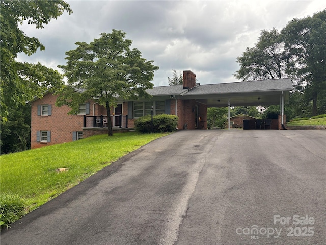 356 Lucky Hollow Rd, Hickory, NC 28601 - single story home with a carport, brick siding, a front lawn, driveway, and a chimney