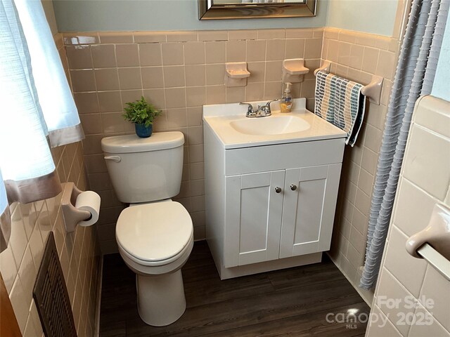 356 Lucky Hollow Rd, Hickory, NC 28601 - bathroom with tile walls, wood finished floors, vanity, and wainscoting