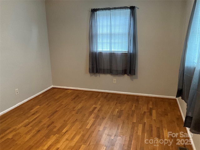 356 Lucky Hollow Rd, Hickory, NC 28601 - empty room with wood finished floors and baseboards