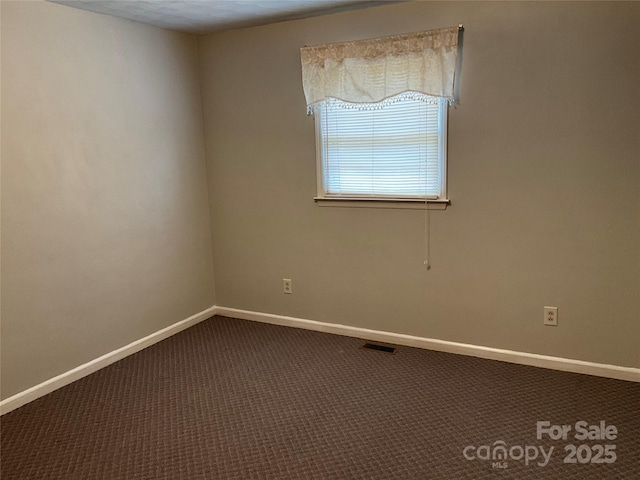 356 Lucky Hollow Rd, Hickory, NC 28601 - spare room featuring dark colored carpet and baseboards