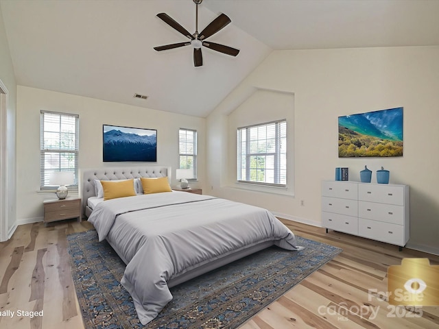 12131 Honor Guard Ave, Charlotte, NC 28277 - bedroom featuring lofted ceiling, multiple windows, wood finished floors, and ceiling fan