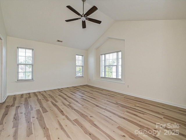 12131 Honor Guard Ave, Charlotte, NC 28277 - spare room with healthy amount of natural light, ceiling fan, light wood-style flooring, and high vaulted ceiling