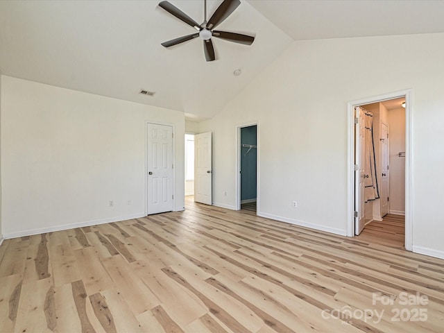 12131 Honor Guard Ave, Charlotte, NC 28277 - unfurnished bedroom with high vaulted ceiling, a walk in closet, light wood-type flooring, ensuite bathroom, and a closet