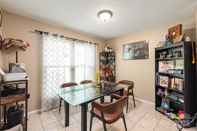 11069 Running Ridge Rd, Charlotte, NC 28226 - dining space with light tile patterned floors, a textured ceiling, and a desk