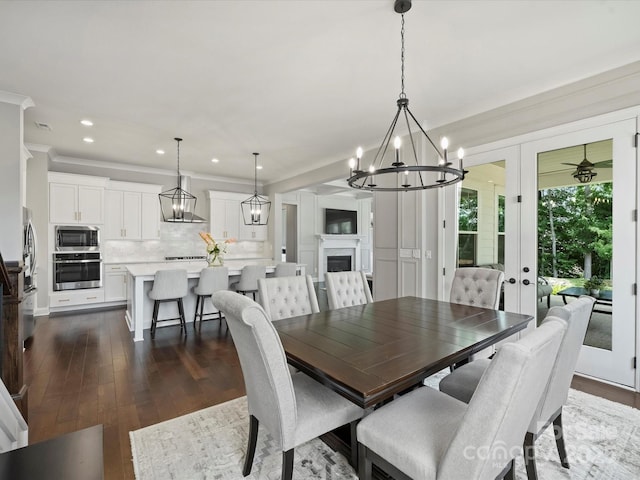 822 River Oaks Ln, Charlotte, NC 28226 - dining room with a chandelier, ornamental molding, dark wood-style flooring, recessed lighting, and french doors
