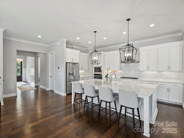 822 River Oaks Ln, Charlotte, NC 28226 - kitchen featuring stainless steel appliances, wall chimney exhaust hood, tasteful backsplash, light countertops, and crown molding