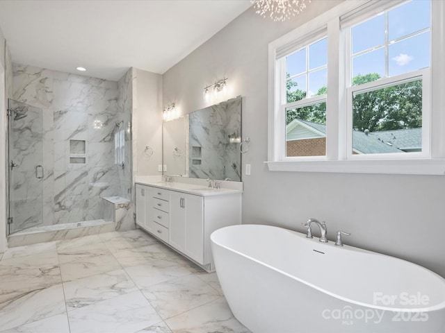 822 River Oaks Ln, Charlotte, NC 28226 - bathroom featuring double vanity, a marble finish shower, a freestanding bath, and marble finish floors