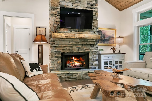 321 Middle Connestee Trl, Brevard, NC 28712 - living room featuring vaulted ceiling, a fireplace, wood finished floors, and wood ceiling