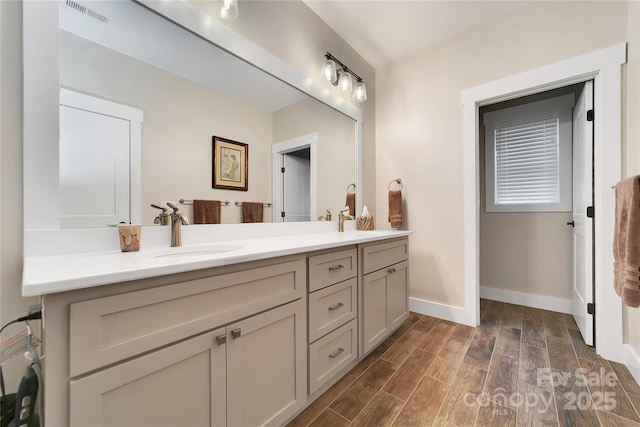 321 Middle Connestee Trl, Brevard, NC 28712 - full bathroom with double vanity and wood finished floors