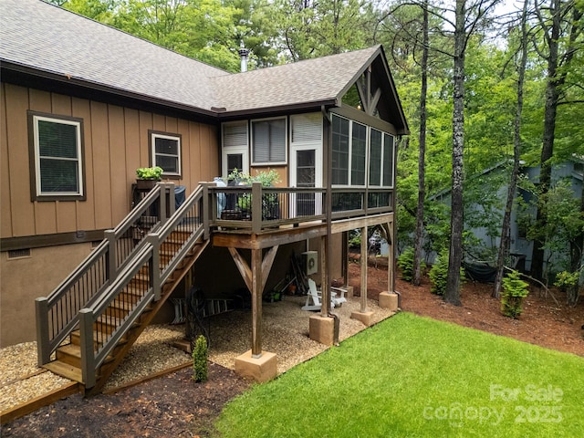 321 Middle Connestee Trl, Brevard, NC 28712 - rear view of property featuring a shingled roof, a wooden deck, stairway, board and batten siding, and a lawn