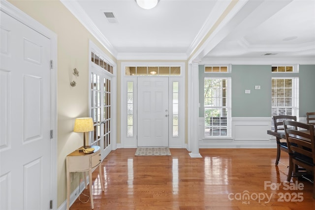 1119 Williamstown Rd, Matthews, NC 28105 - foyer featuring ornamental molding, wood finished floors, and a wainscoted wall