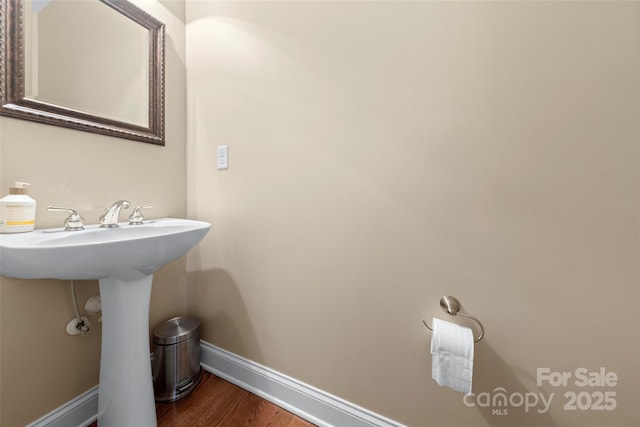 1119 Williamstown Rd, Matthews, NC 28105 - bathroom with baseboards and wood finished floors