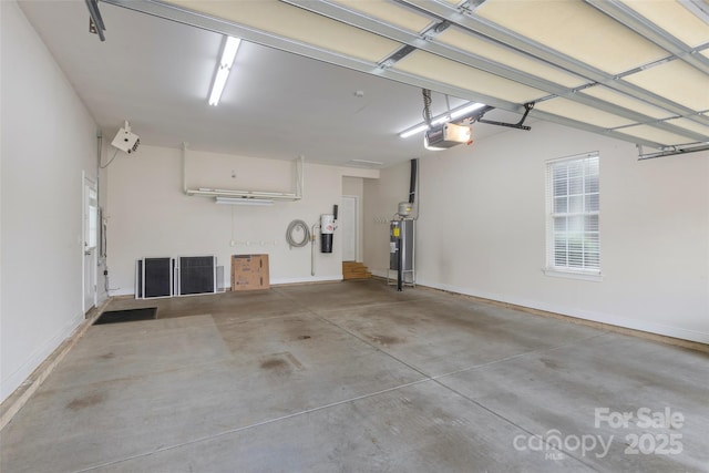 1119 Williamstown Rd, Matthews, NC 28105 - garage featuring a garage door opener and electric water heater