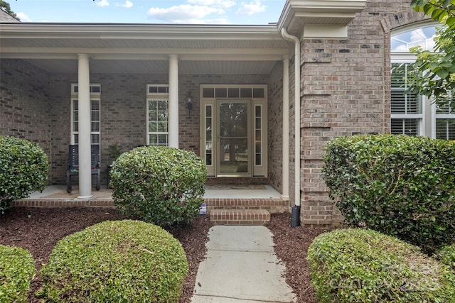 1119 Williamstown Rd, Matthews, NC 28105 - view of exterior entry featuring brick siding and covered porch