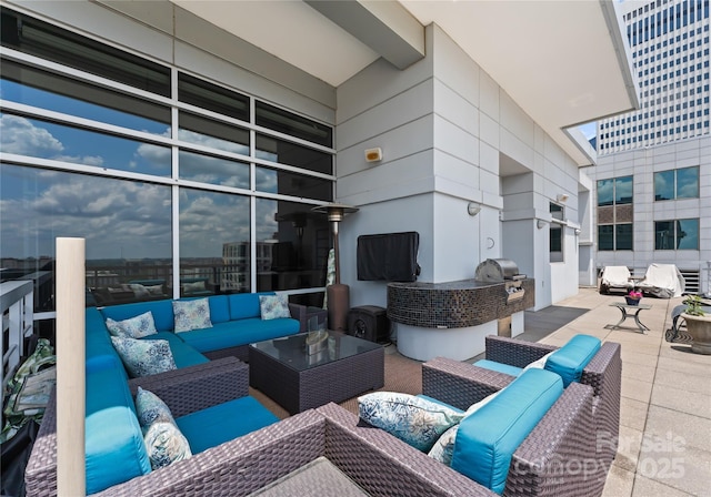 435 S Tryon St Unit 907, Charlotte, NC 28202 - view of patio with an outdoor hangout area and an outdoor kitchen
