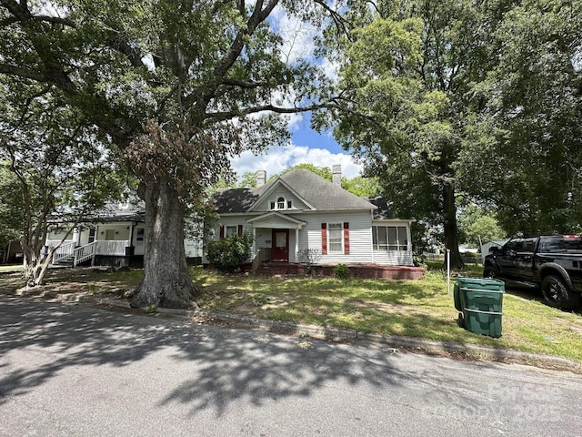 118 Hemphill Ave, Chester, SC 29706 - view of front of house with a chimney, a porch, and a sunroom