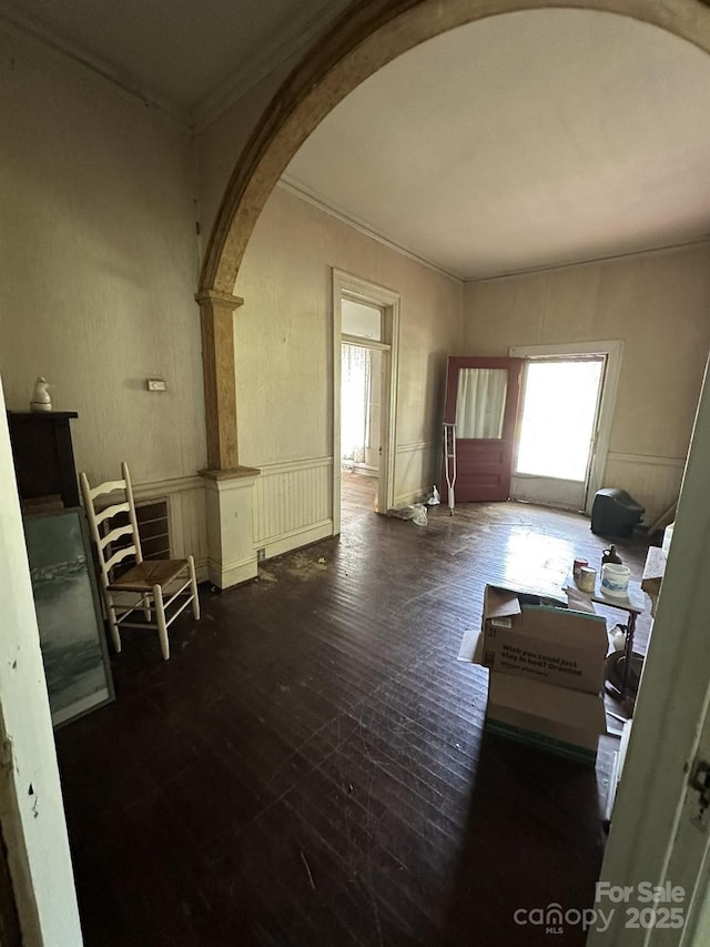 118 Hemphill Ave, Chester, SC 29706 - living room featuring arched walkways, ornamental molding, and wood-type flooring