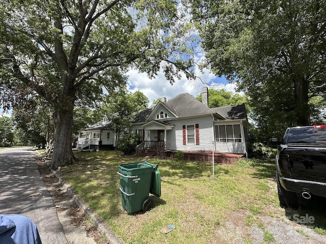 118 Hemphill Ave, Chester, SC 29706 - view of front of house featuring a chimney and a front lawn