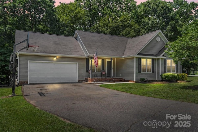 124 Turning Leaf Ln, Statesville, NC 28677 - view of front of property with covered porch, driveway, a front yard, and a garage