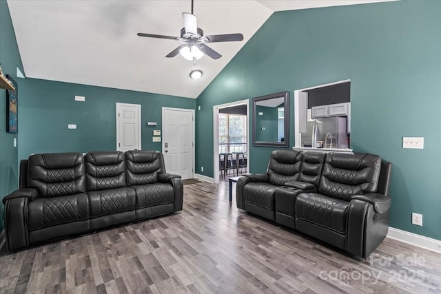 124 Turning Leaf Ln, Statesville, NC 28677 - living room featuring a ceiling fan, high vaulted ceiling, and wood finished floors