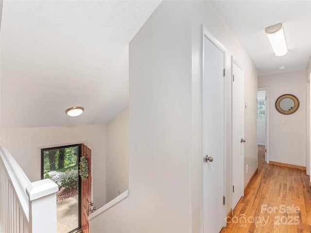 623 Nellie John Dr, Clyde, NC 28721 - hallway featuring light wood-style flooring and baseboards
