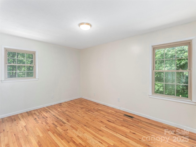 623 Nellie John Dr, Clyde, NC 28721 - empty room with light wood-style flooring and baseboards
