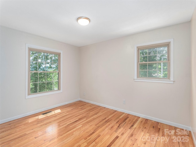 623 Nellie John Dr, Clyde, NC 28721 - spare room with baseboards and light wood-style floors