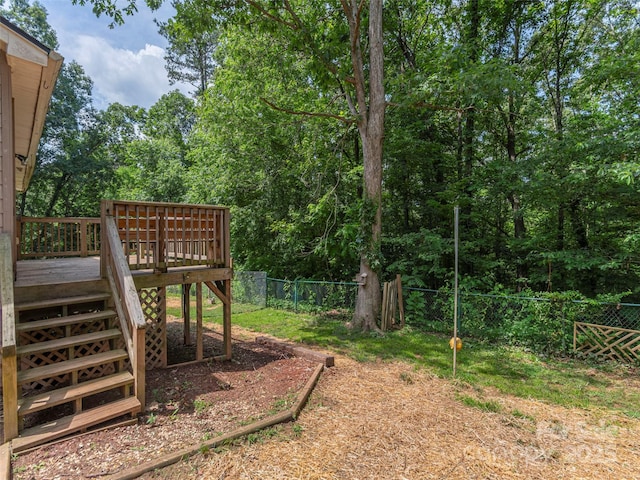 623 Nellie John Dr, Clyde, NC 28721 - fenced backyard featuring a wooden deck and stairs