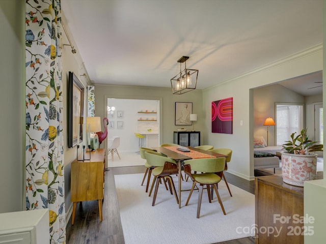 116 Hallett St, Fort Mill, SC 29715 - dining area with wood finished floors, ornamental molding, and a chandelier