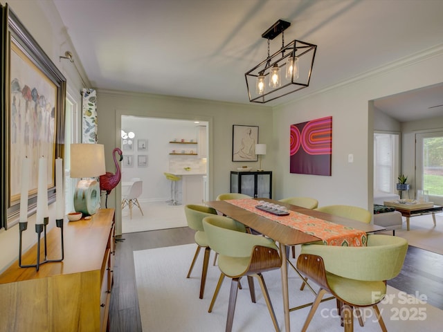 116 Hallett St, Fort Mill, SC 29715 - dining space with wood finished floors, ornamental molding, and a chandelier