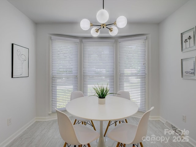 116 Hallett St, Fort Mill, SC 29715 - dining area with a chandelier and baseboards